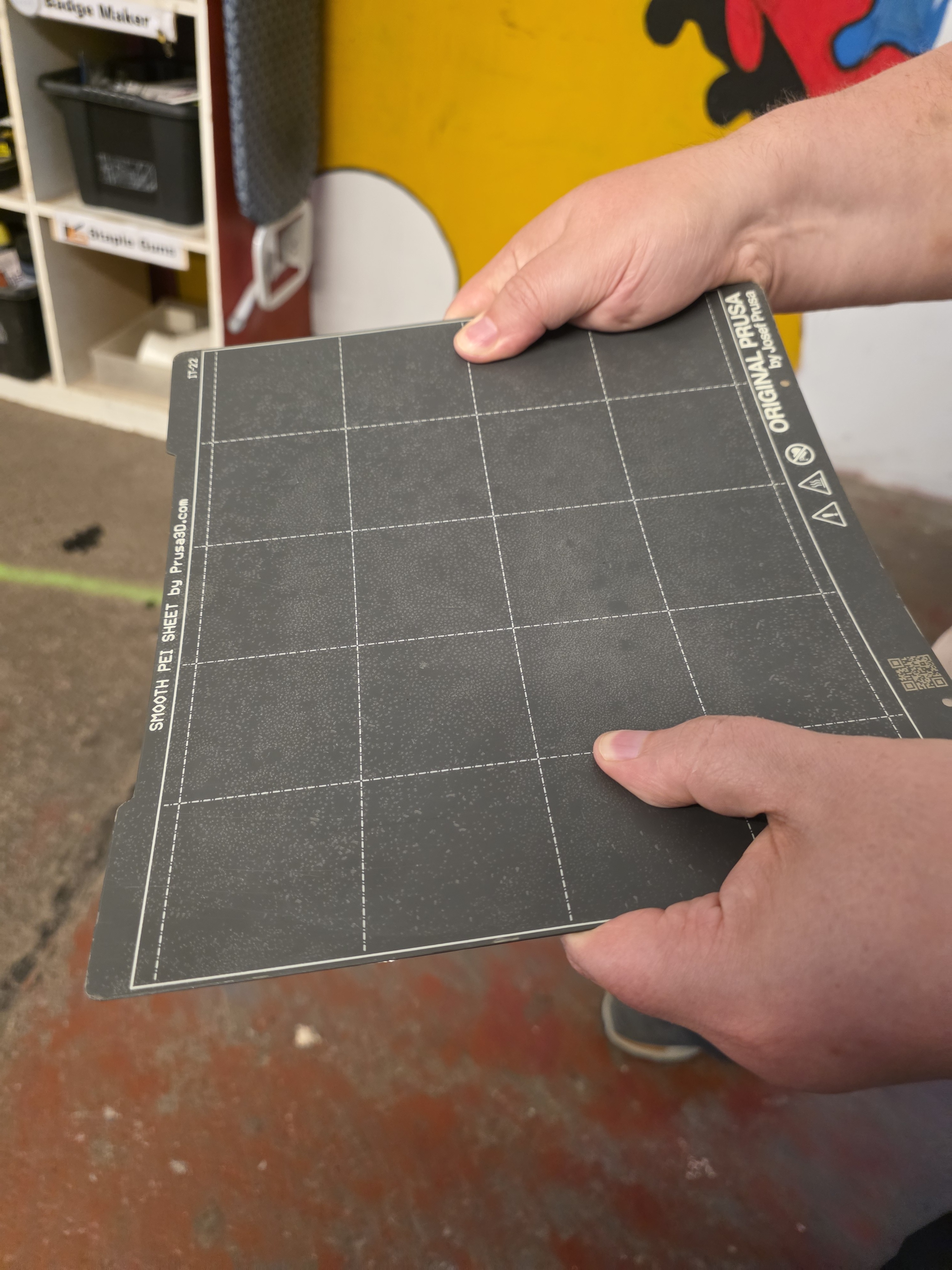 Flexing a build plate to release a print