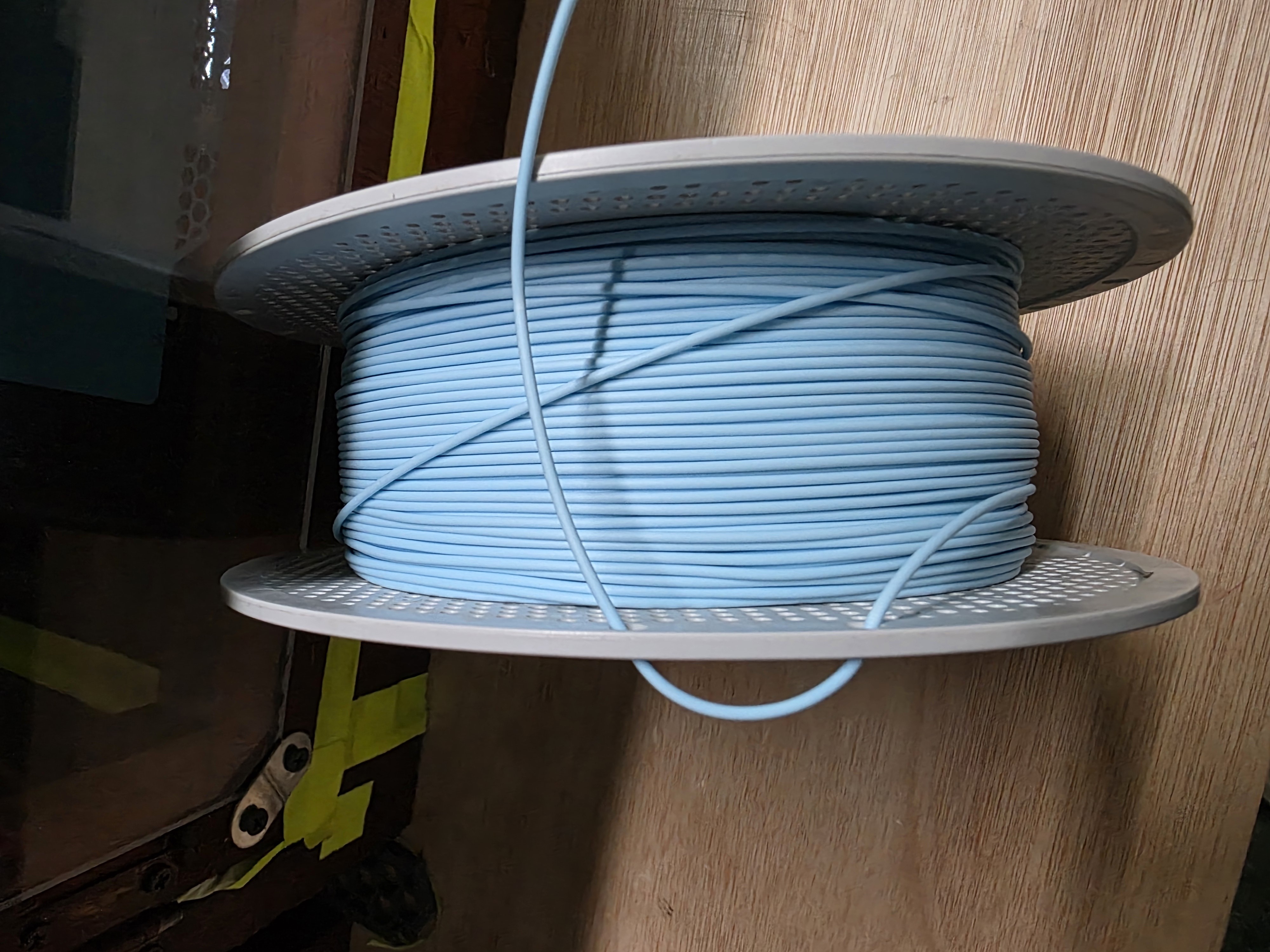 Filament end secured for storage